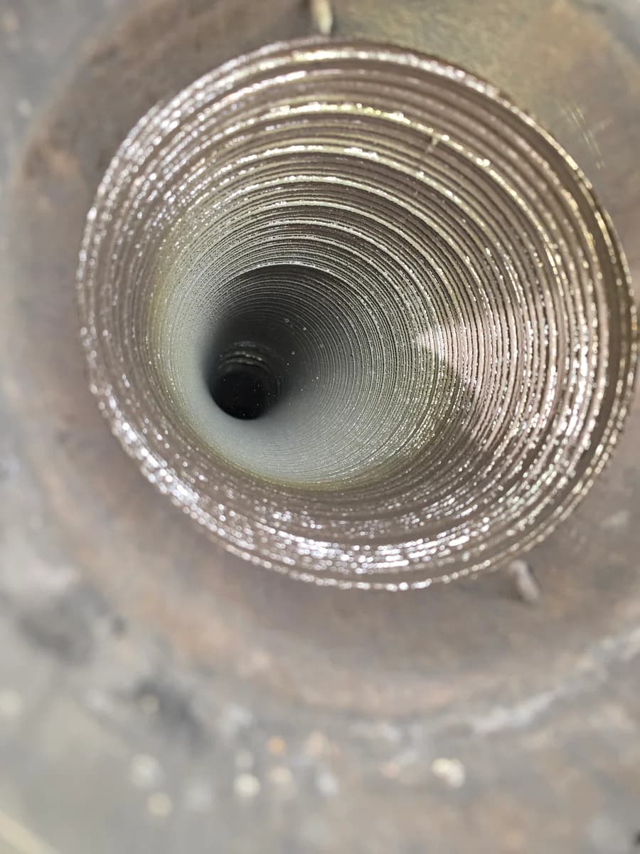 Wood stove liner after cleaning with a clearer venting path