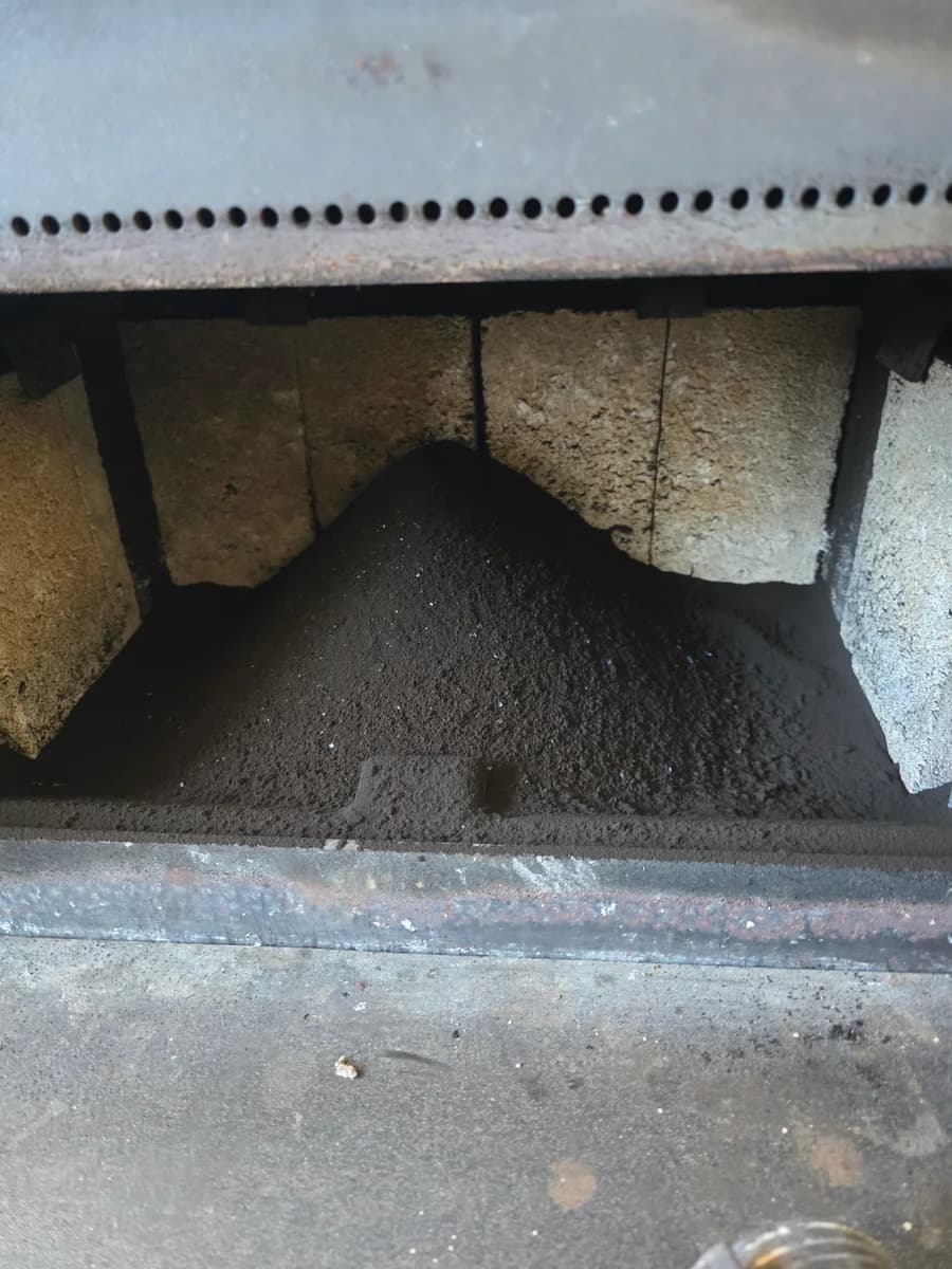 Soot buildup inside a wood stove firebox