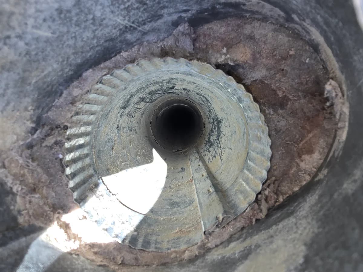 Lint buildup visible inside a roof dryer vent termination