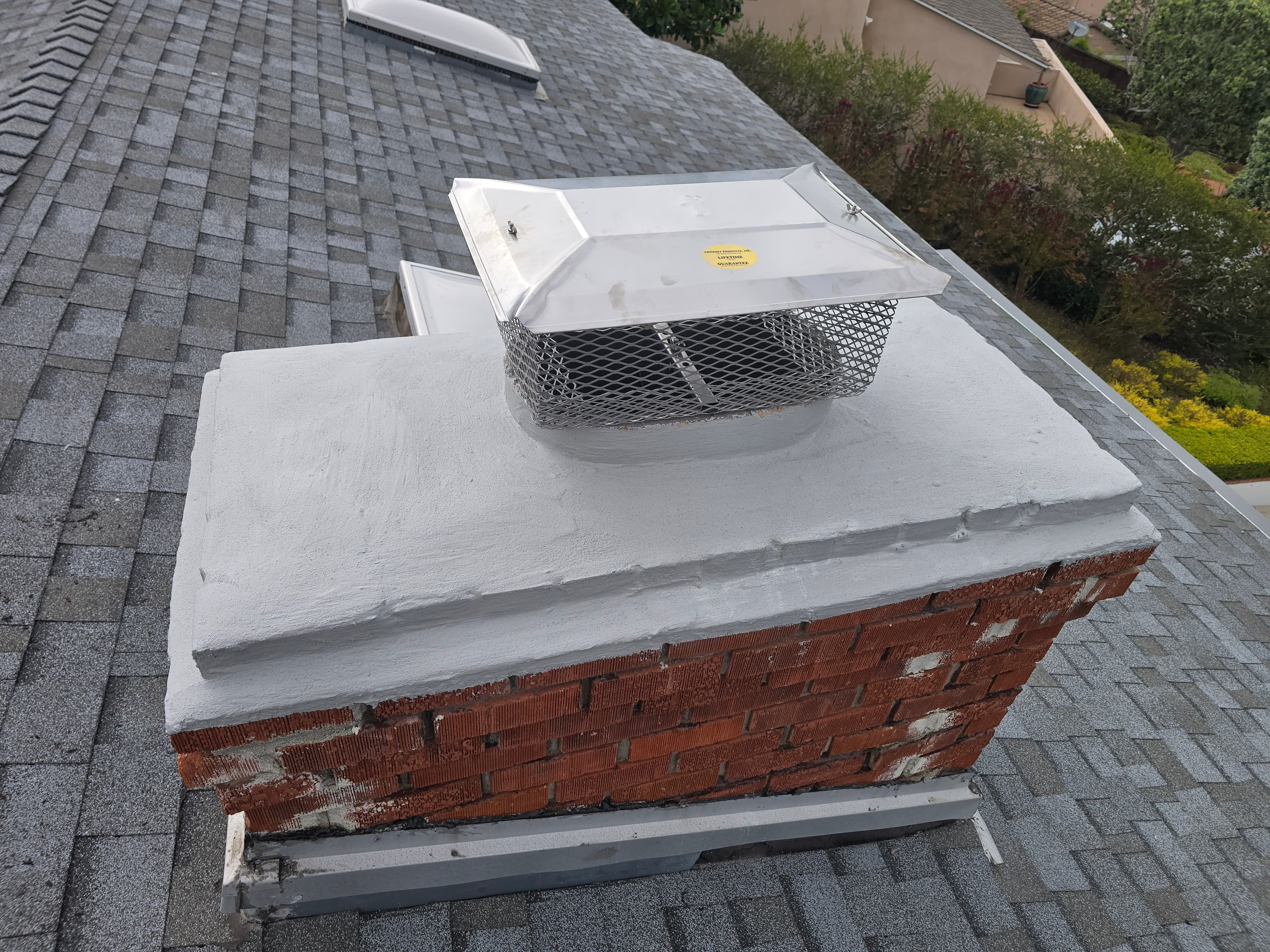 Waterproofed chimney crown after professional repair